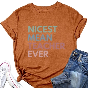 Flat lay of rust orange Nicest Mean Teacher Ever t-shirt with jeans and sneakers