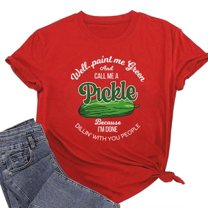 Detail of red cotton T-shirt featuring funny pickle print with soft fabric texture