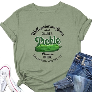 Flat lay of sage green cotton t-shirt featuring Pickle print and rolled sleeves detail