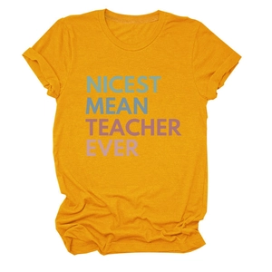 Detail of nicest mean teacher ever colorful print on a yellow crew neck t-shirt