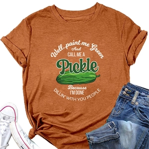 Detailed flat lay of burnt orange cotton t-shirt with vintage pickle graphic and slogan