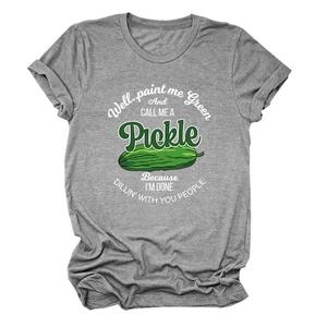 Detail of funny green pickle print on a grey cotton t-shirt with humorous quote