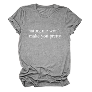 Detail of grey crewneck t-shirt fabric with white slogan hating me won't make you pretty