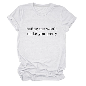 Detail of white cotton T-shirt featuring 'hating me won't make you pretty' slogan print