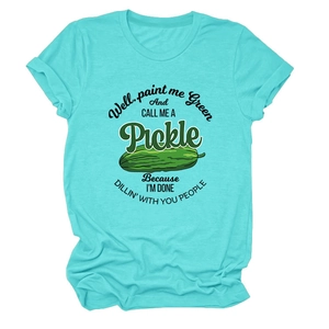 Detail of teal crew neck t-shirt featuring humorous quote and green pickle illustration