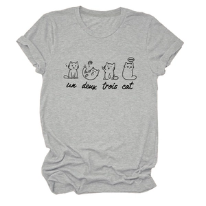Close-up of lightweight grey t-shirt featuring artistic cat drawings and French typography