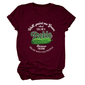 Detail of burgundy T-shirt showing green pickle illustration and humorous white typography
