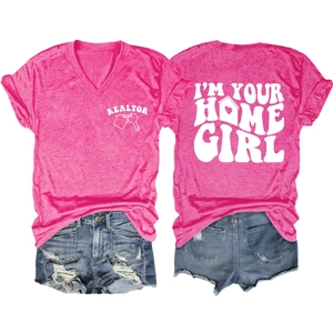 Flat lay of pink V-neck t-shirt with Realtor prints and distressed blue denim shorts