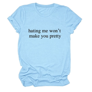 Detail of light blue cotton T-shirt with rolled sleeves and hating me won't make you pretty text