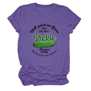 Close-up of purple heather fabric and playful green pickle graphic on a crewneck t-shirt