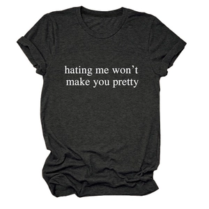 Detail of grey crewneck T-shirt showing rolled cuffs and the slogan print