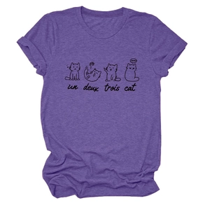 Close-up of cute cat sketches and French text printed on purple cotton T-shirt