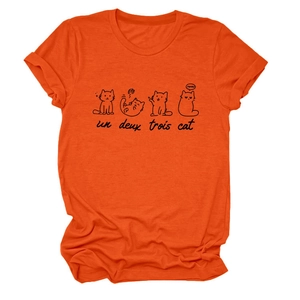 Detail of cute cat sketches and French text un deux trois cat on orange cotton t-shirt