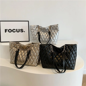 Quilted tote bags in metallic silver, gold, and black with elegant chain shoulder straps