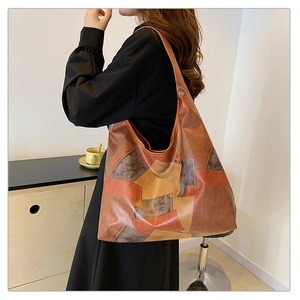 Close-up of retro color-block patchwork tote bag showing large capacity and texture