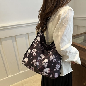 Large black nylon tote bag with skull and floral print and 'LOVE' lettered straps