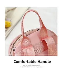 Close-up of comfortable pink bag handle with cartoon patterns and textured PU leather