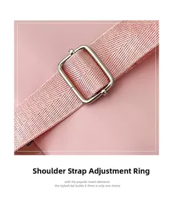 Detail of adjustable pink shoulder strap and silver metal buckle on travel backpack