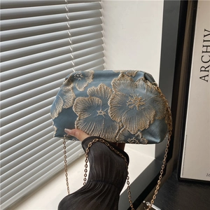 Blue silk clutch bag with gold floral embroidery and elegant metal chain strap