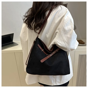 Detail of color-block tote bag showing contrast straps and high-capacity rectangular design