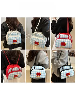 Detail shots showing the blue and white checkered backpack with a red apple print