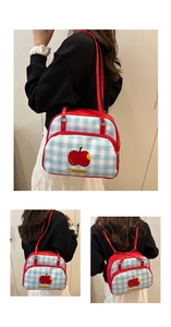 Detail of blue plaid multi-functional backpack with apple print and red straps