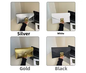 Detail of envelope clutch bags with geometric metal clasps in silver, gold, and black