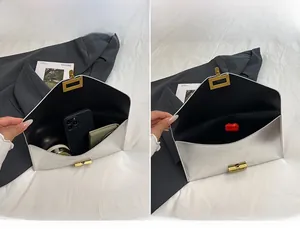 Internal view of a silver envelope clutch bag showing main compartment and storage capacity