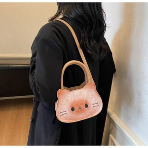 Detail view of cartoon cat toast handbag with realistic bread texture and leather straps