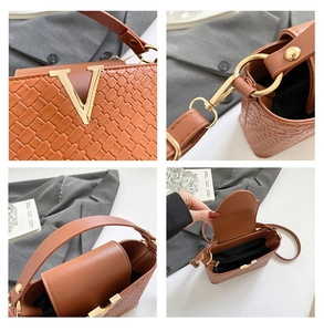 Detail of brown woven PU leather bag showing golden V-shaped hardware and internal lining
