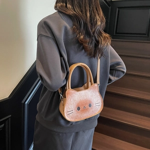 Cute cartoon cat shaped shoulder bag in toasted brown finish with metal hardware details