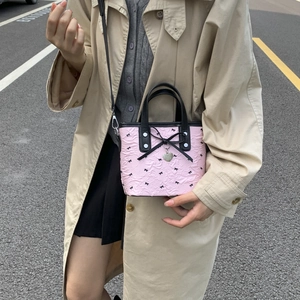 Pink bow bucket bag with heart charm, stylish crossbody handbag for women's fashion
