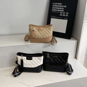 Chic quilted crossbody bucket bags for women in contrasting brown, white, and black colors