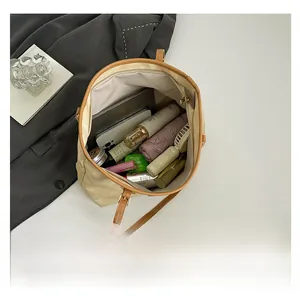 Top view of cream tote bag interior showing large capacity for tablet and daily items
