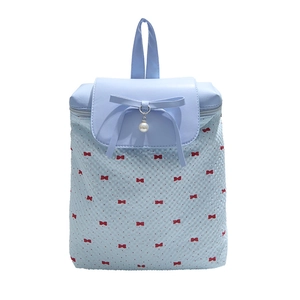 Light blue school backpack for girls with polka dot print and bow pearl decoration