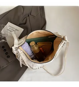Interior view showing the large capacity of the beige PU leather crossbody chain bag