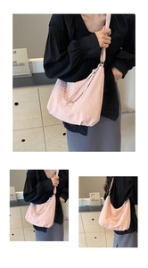 Pink large capacity hobo bag detail with silver chain and wide shoulder strap