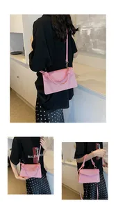 Detailed views of pink woven flap handbag with knotted handle and fine textured finish
