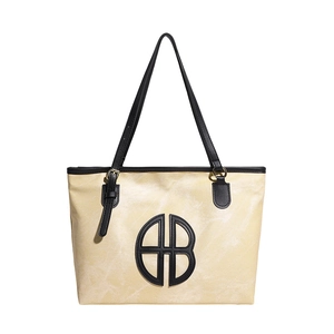 Sac cabas minimaliste beige à motif marbre avec lanières noires et logo géométrique