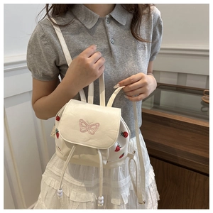Mini white faux leather backpack with strawberry prints and pink butterfly embroidery
