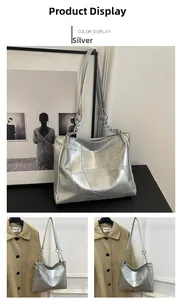 Detail of silver metallic tote bag with geometric stitching and chain shoulder strap