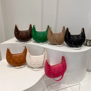 Fashionable textured underarm bags in multiple colors with a geometric embossed pattern