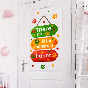Colorful monster theme wall stickers with wooden signs and paw prints for nursery decor