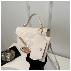 White quilted handbag set with gold metal bar detail and small detachable coin purse