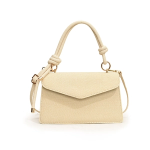 Minimalist beige textured square crossbody bag with rope handle and gold hardware