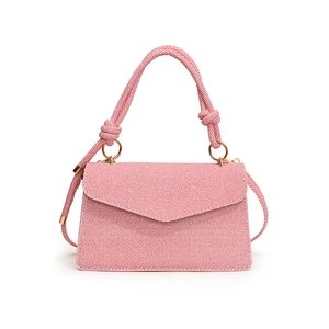 Pink textured minimalist square handbag with knotted top handle and gold ring accents