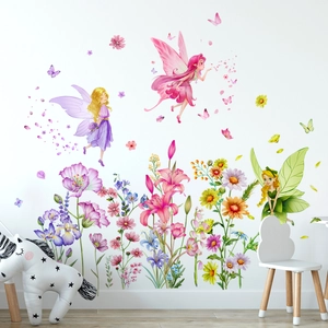 Detailed wall sticker layout featuring fairy girls and flowers in a cozy nursery bedroom