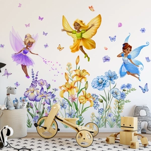 Detail of floral butterfly fairy wall stickers on white wall with nursery decor