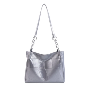 Silver metallic tote bag with irregular stitching and Y2K futuristic style design