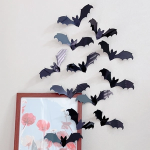 3D black bat wall stickers in various sizes for Halloween decor on white walls